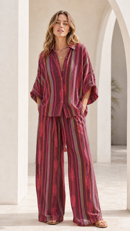 Model wearing burgundy multi striped lounge set