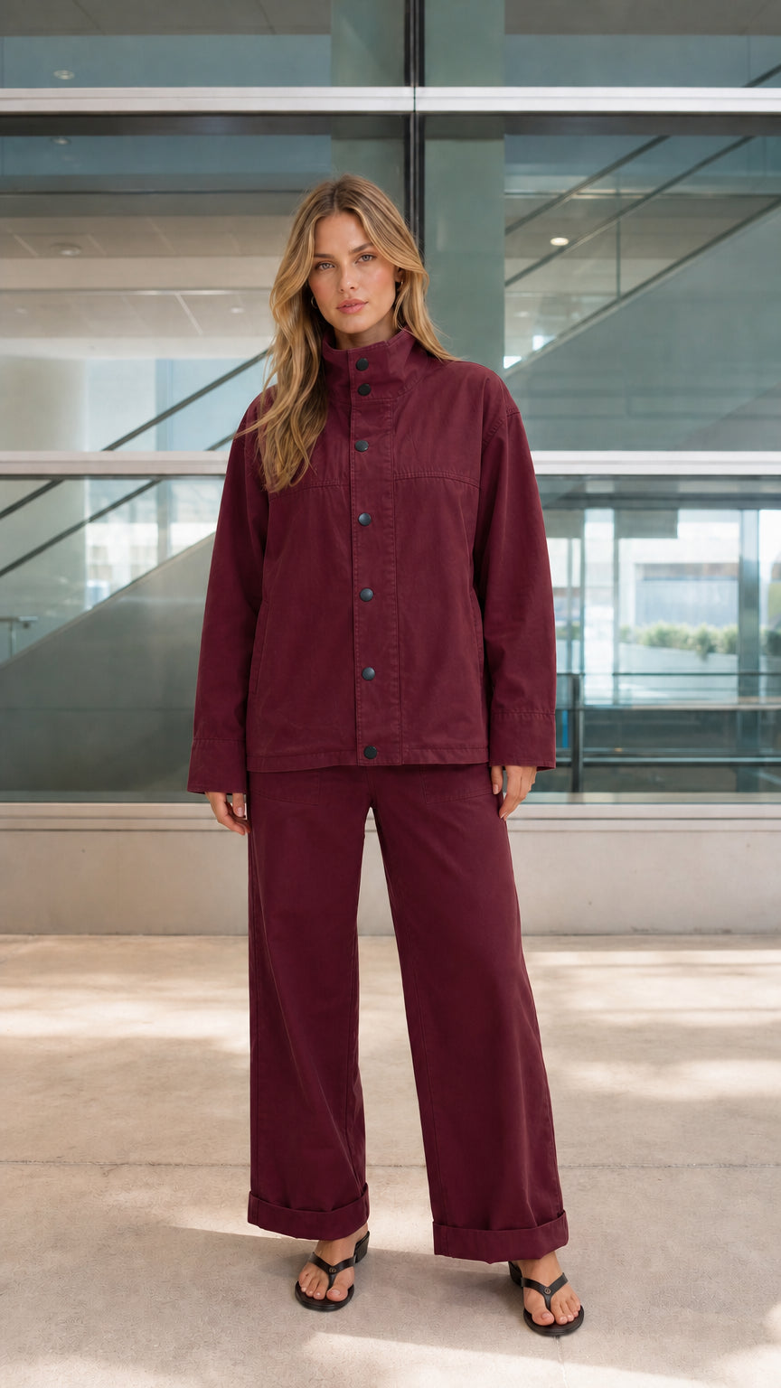 Woman wearing burgundy two-piece relaxed utility matching set