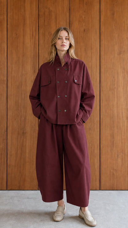 Woman wearing burgundy utility jacket and wide-leg pants set
