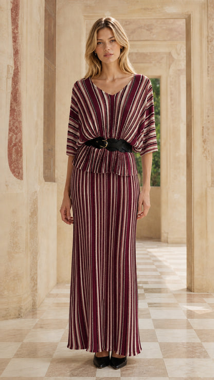 Woman wearing burgundy striped two-piece maxi dress set