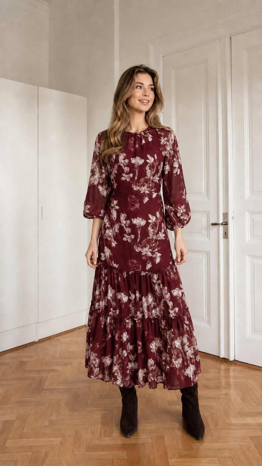 Woman wearing burgundy floral print long sleeve tiered midi dress