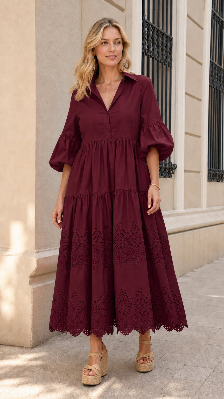Front view of woman wearing burgundy collared tiered midi dress