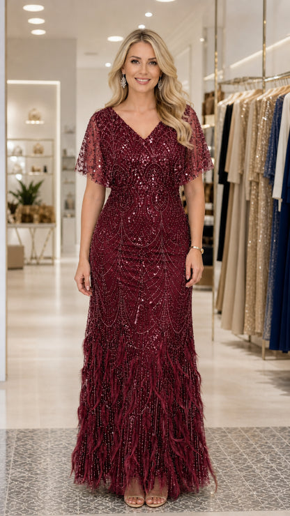 Front view of woman wearing burgundy sequin evening gown