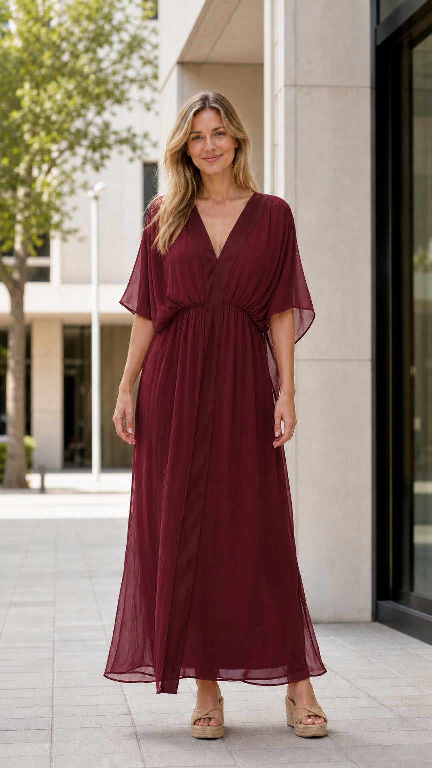 Front view of model wearing burgundy maxi kaftan dress