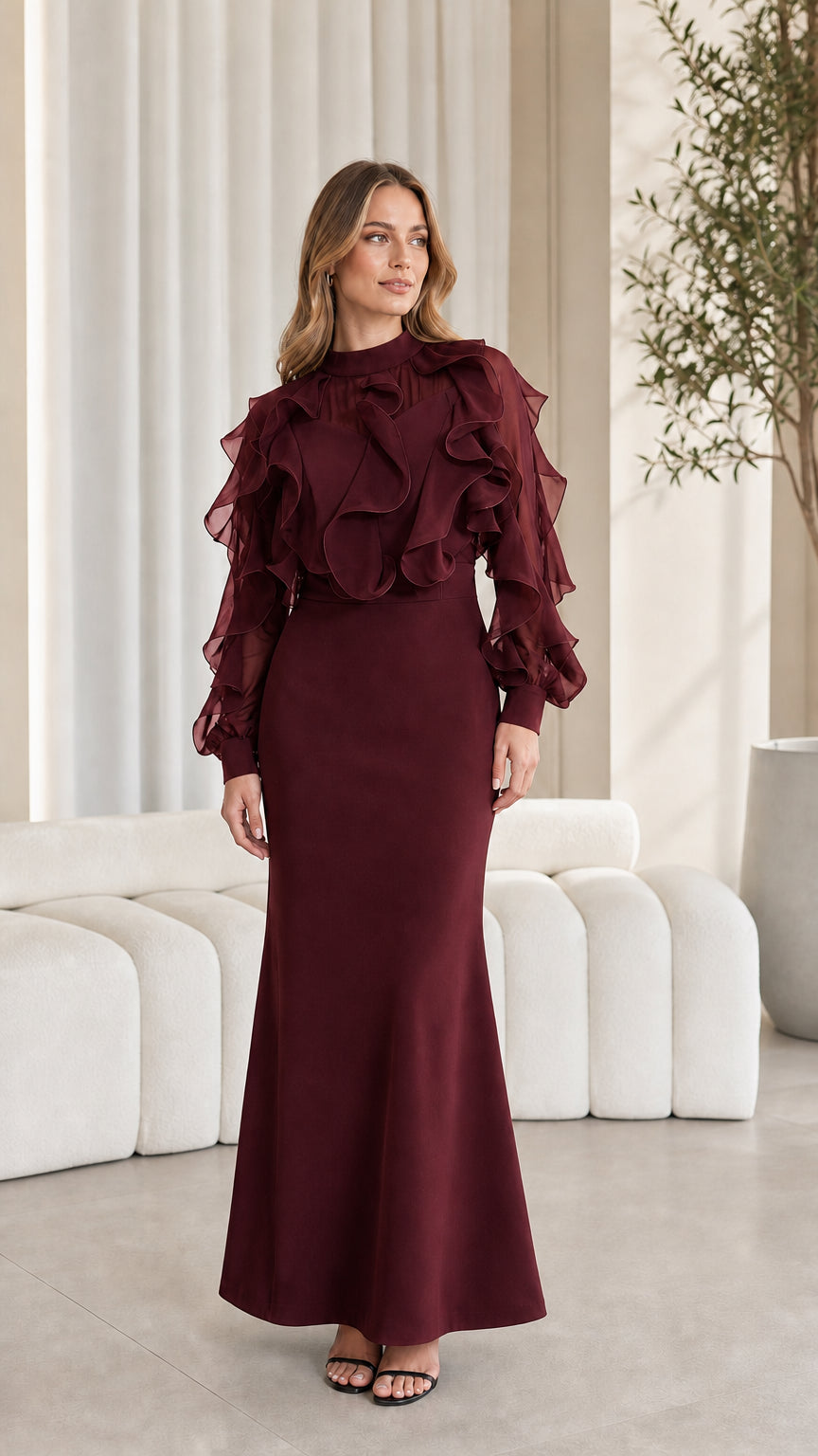 Full-length view of burgundy ruffled evening maxi dress