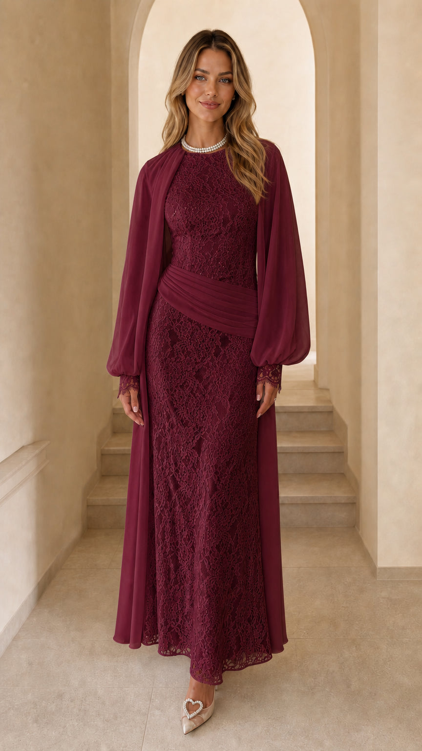 Front view of woman wearing burgundy long sleeve lace maxi dress