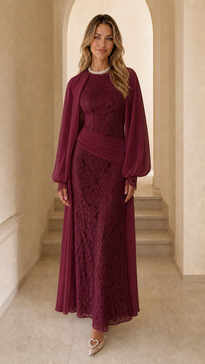 Front view of woman wearing burgundy long sleeve lace maxi dress
