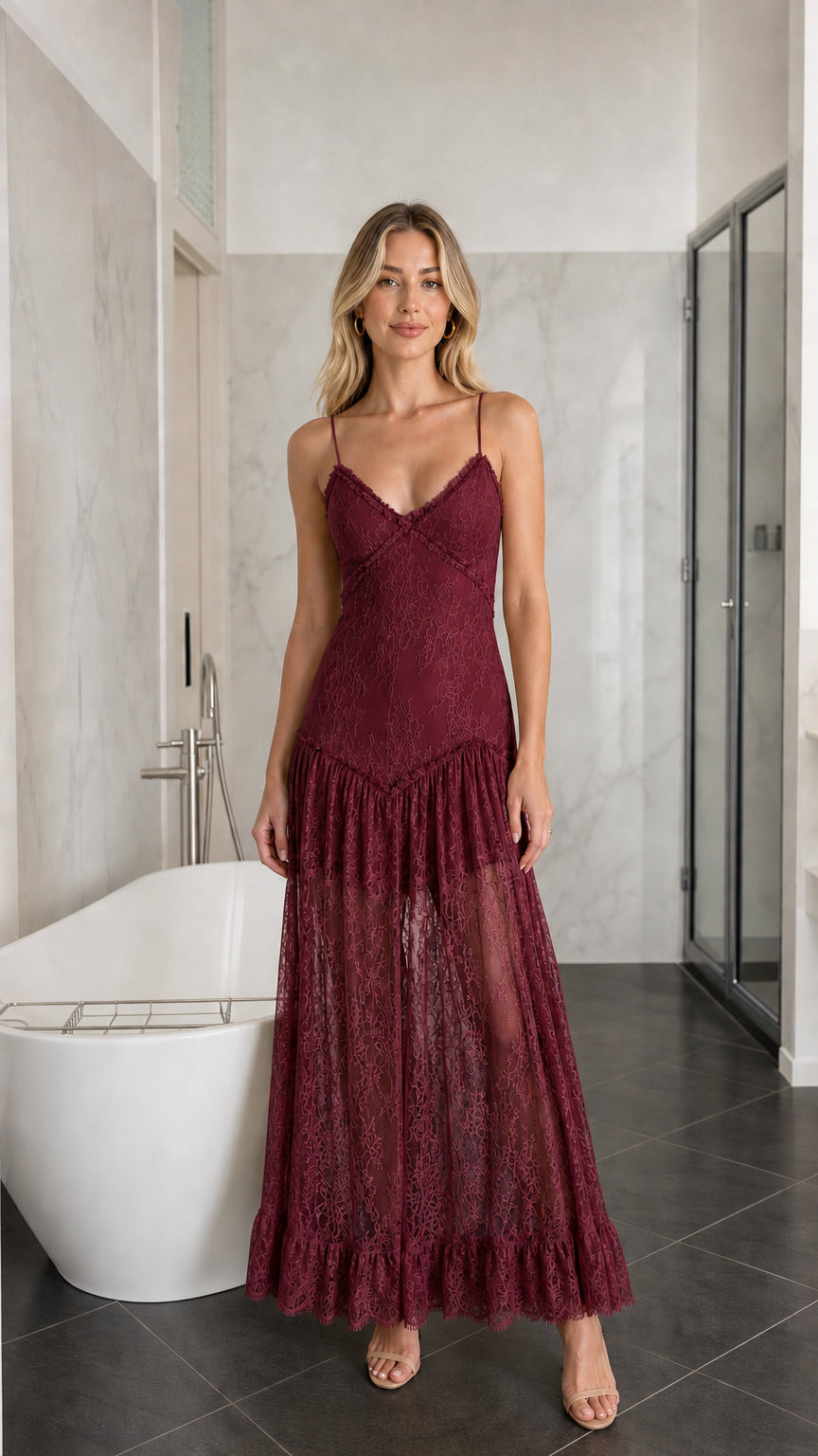 Front view of woman wearing burgundy lace tiered maxi slip dress