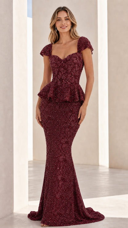 Front view of burgundy embellished evening gown