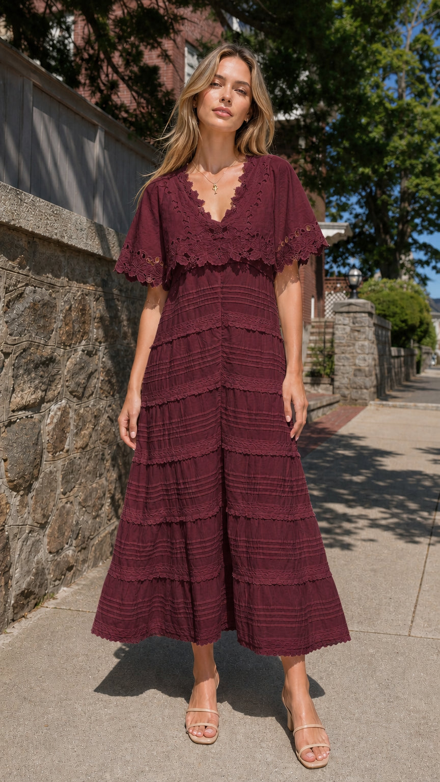 Full view of woman wearing burgundy eyelet lace cape sleeve maxi dress