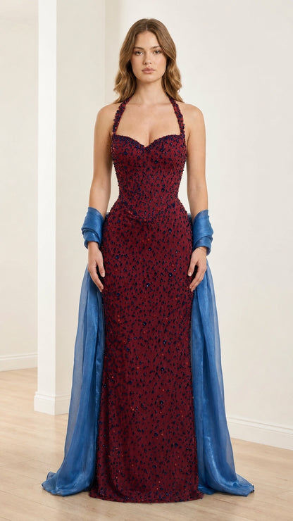 Front view of burgundy embellished halter evening gown