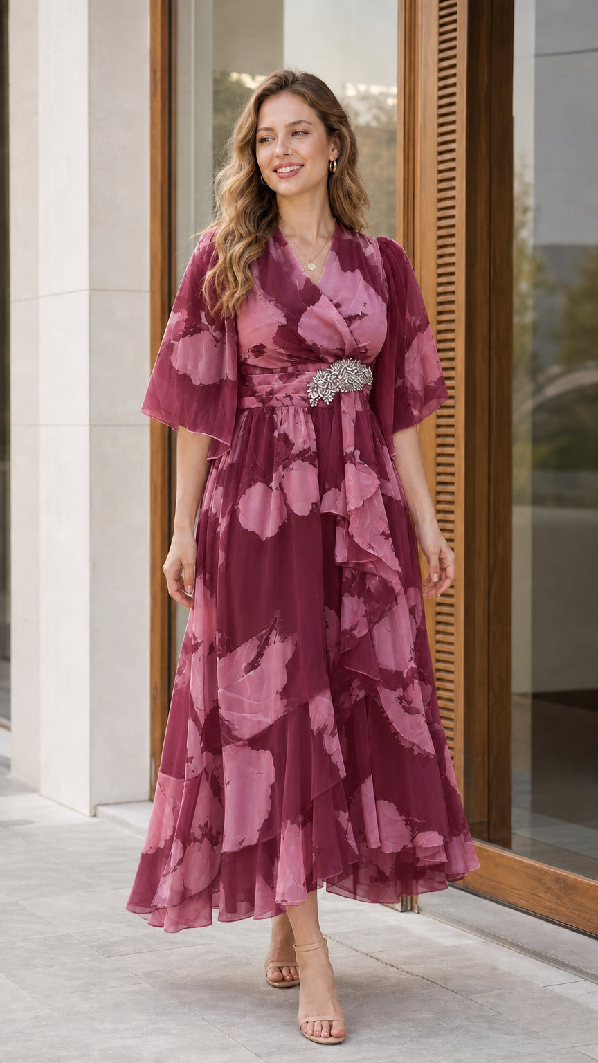 Woman wearing burgundy wine floral chiffon flutter sleeve midi dress