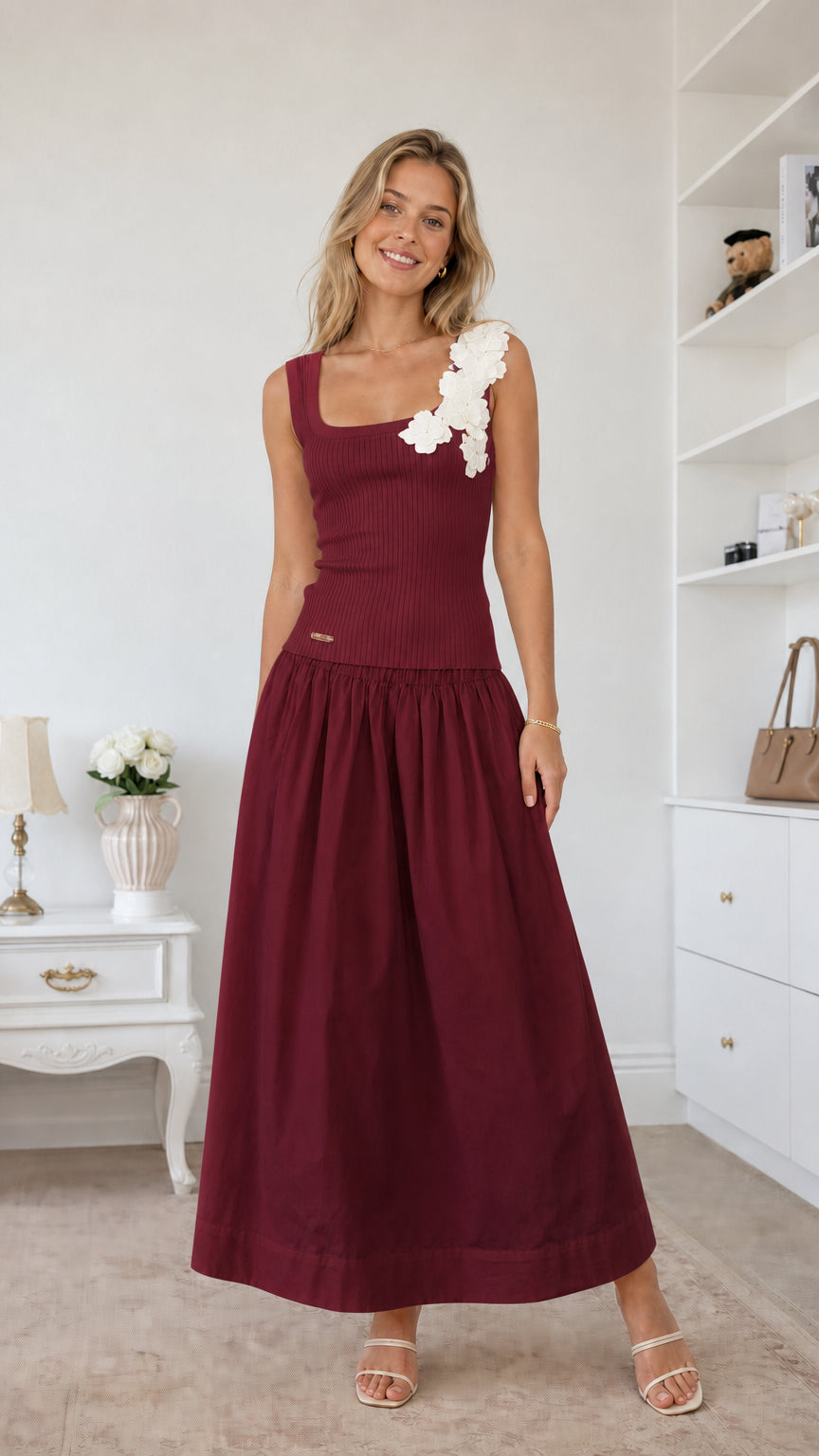 Model wearing burgundy color variant of the floral applique midi dress