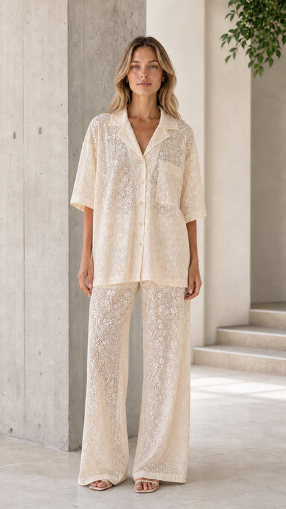 Front view of woman wearing cream lace shirt and pants set