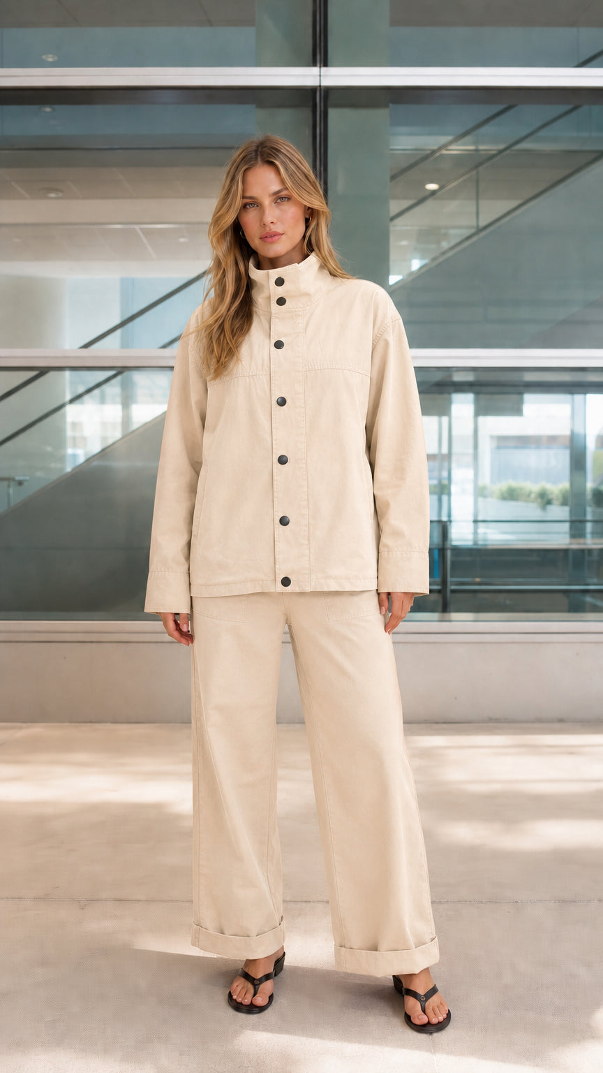 Woman wearing beige two-piece utility overshirt and wide-leg trousers set