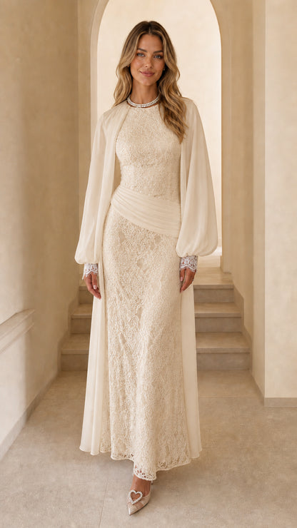 Front view of woman wearing champagne long sleeve lace maxi dress