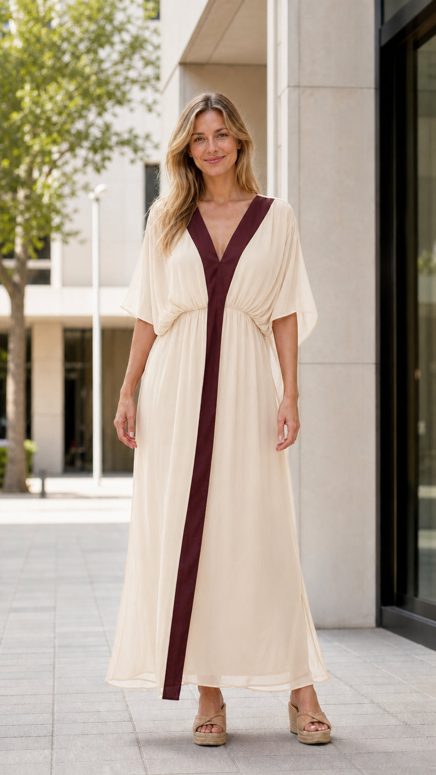 Front view of model wearing cream maxi kaftan dress