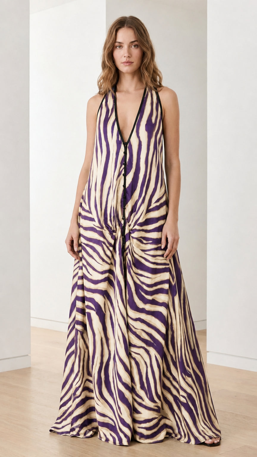 Woman wearing cream and purple zebra print halter maxi dress