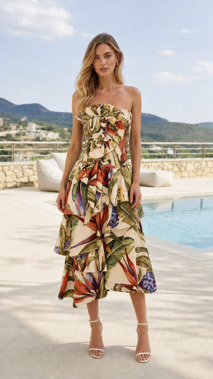 Front view of model wearing beige tropical print strapless midi dress