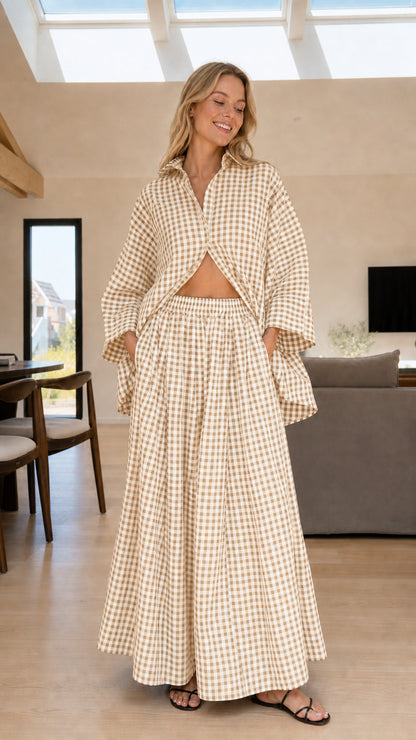 Woman wearing beige and white gingham check shirt and wide-leg pants set